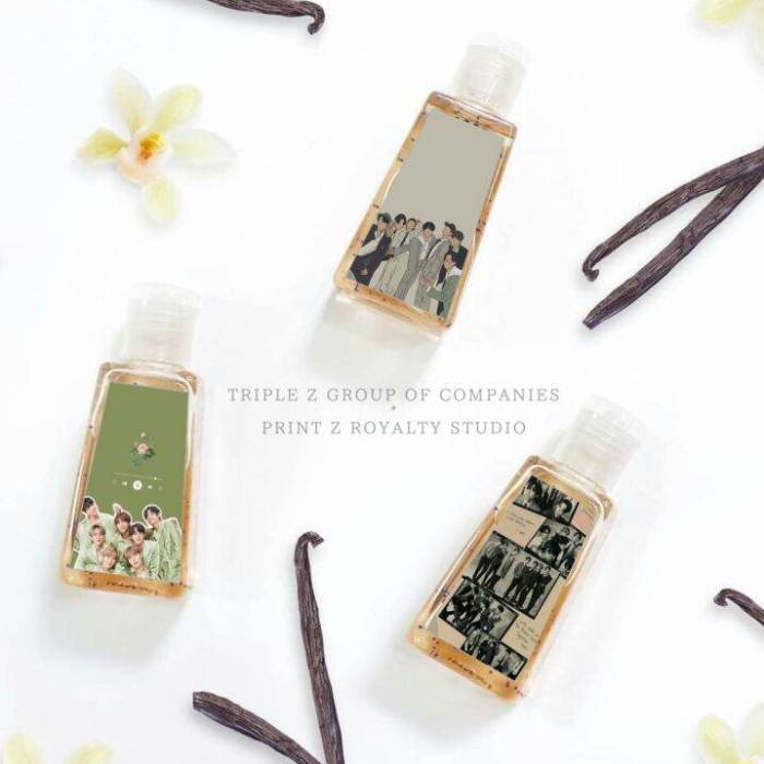 Beautiful young south east Asian woman posing holding transparent liquid hand sanitizer plastic ...